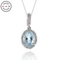 Aquamarine and Diamond Halo Pendant in 14K